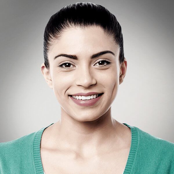 team-member-woman-green-shirt-gray-background team-member-woman-green-shirt-gray-background